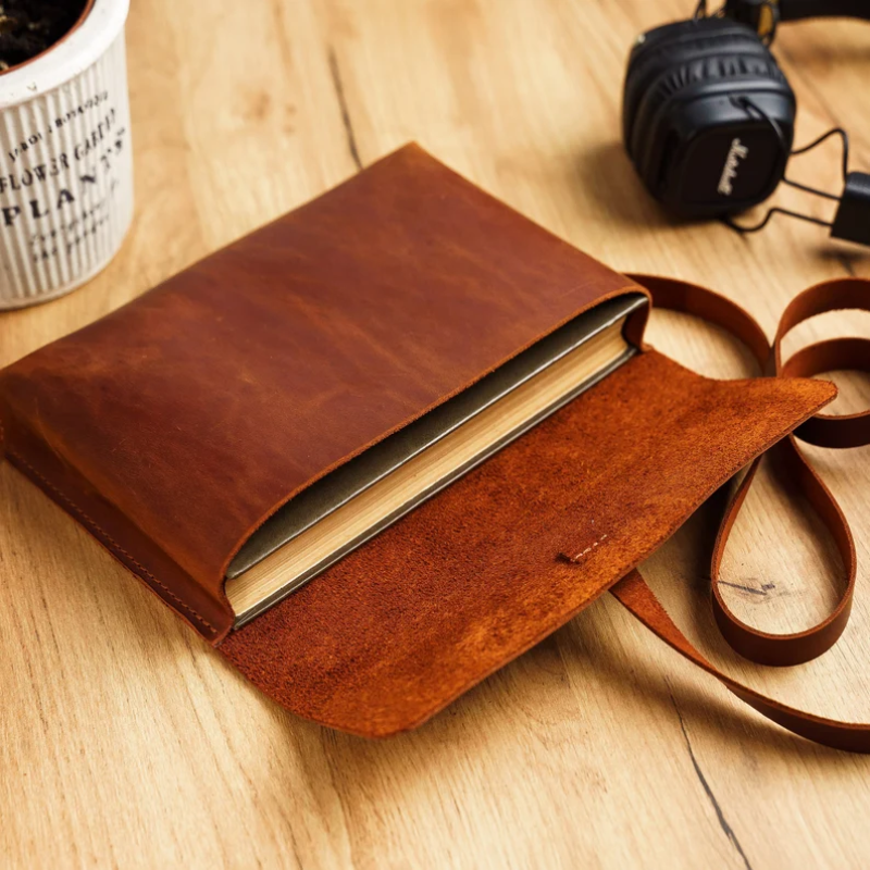 34. Handcrafted Leather Book Cover: A Unique 7th Anniversary Gift for Book Lovers