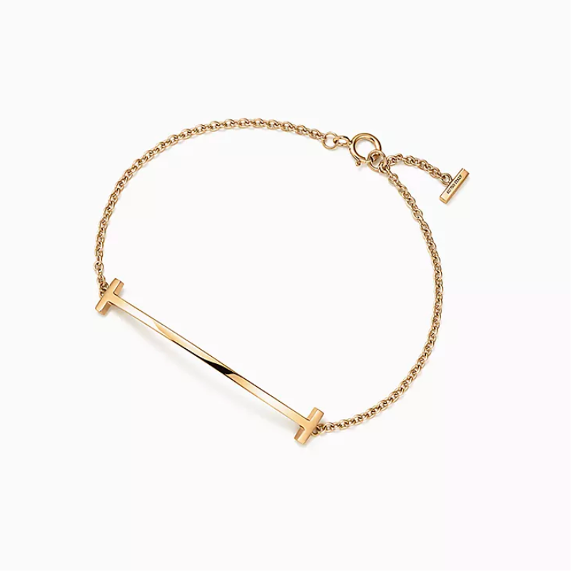 4. Timeless Elegance: Celebrate 14 Years with a Classic Gold Bangle